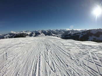 Scenic view of snow covered mountains against sky