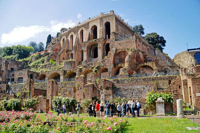 Group of people in front of historical building