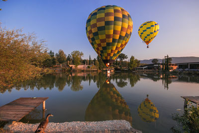 Wonderful view of two hot air balloons on the lake