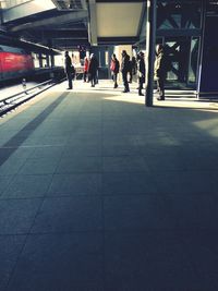 View of woman walking on tiled floor