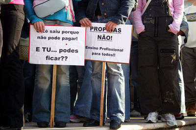 Low section of people standing in street