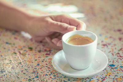 Close-up of coffee cup on table