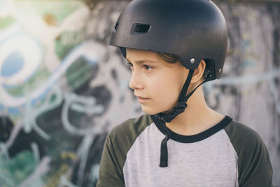 Close-up of boy wearing skateboard helmet