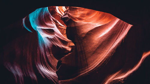 Close-up of rock formation against black background