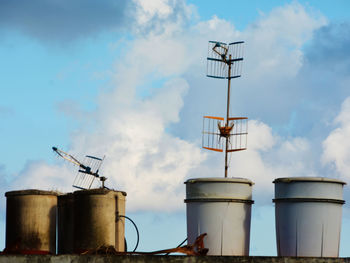 Low angle view of crane against sky