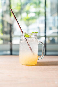 Close-up of drink in glass jar on table