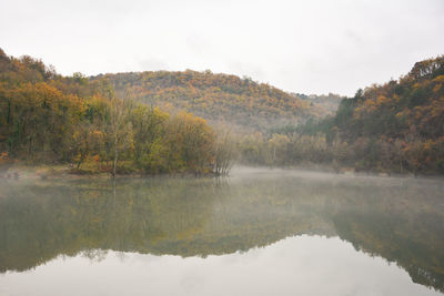 Scenic view of lake against sky during autumn