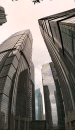 Low angle view of modern buildings against sky