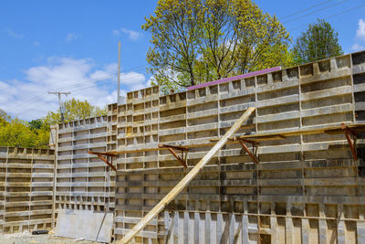 Low angle view of building under construction against sky