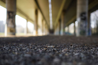 Surface level on stones against bridge