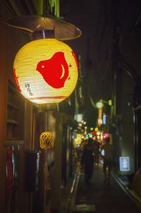 Illuminated lanterns hanging at night