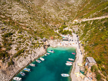 Aerial view of sea and landscape against sky