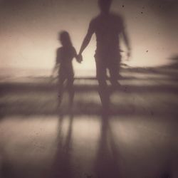 Silhouette woman standing against white background