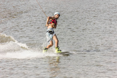 Man kite boarding in river