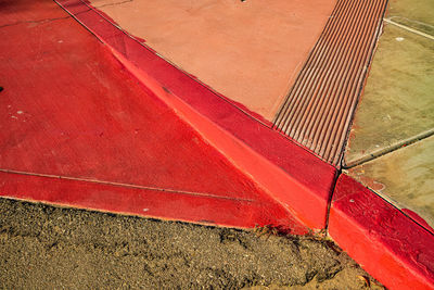 High angle view of red shadow on floor