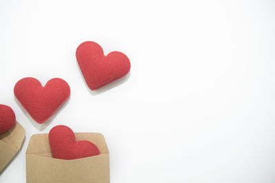 Close-up of heart shape over white background