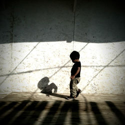 Boy standing in amusement park