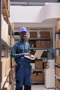 Portrait of young man working at construction site