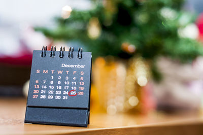 Close-up of calendar on table