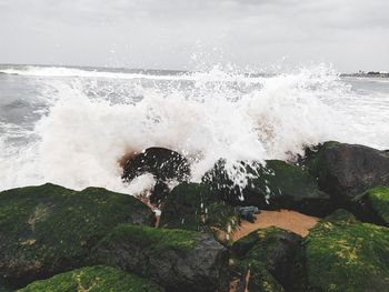 Sea waves splashing on rocks