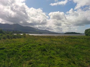 Scenic view of landscape against cloudy sky