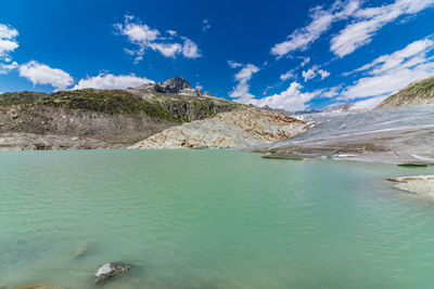 Scenic view of lake against blue sky