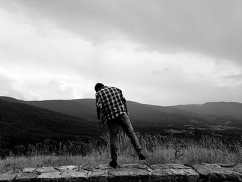 Scenic view of landscape against cloudy sky