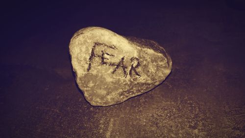 Close-up of text on stone wall