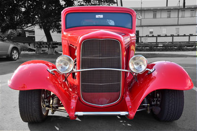 Red vintage car on street