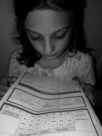 Portrait of girl holding paper
