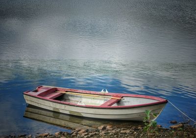 High angle view of boat moored in lake