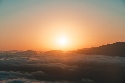 Scenic view of mountains against sky during sunset