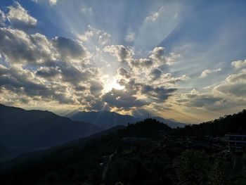 Scenic view of silhouette mountains against sky during sunset