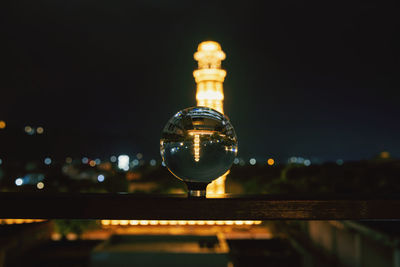 Close-up of illuminated lighting equipment at night