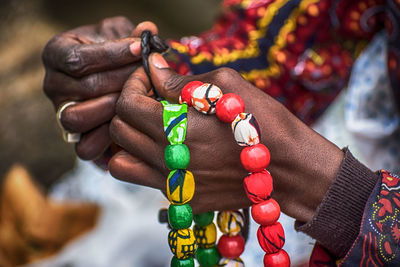 Close-up of hand holding beads