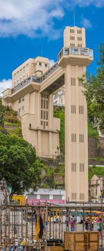 Gazebo in city against sky