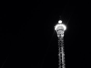 Low angle view of illuminated light against clear sky at night