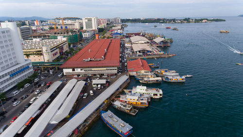 High angle view of cityscape by sea