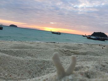 Scenic view of beach against sky during sunset