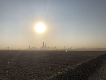 Scenic view of field against sky during sunset