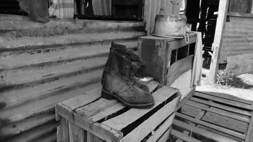 High angle view of old bench on staircase by building