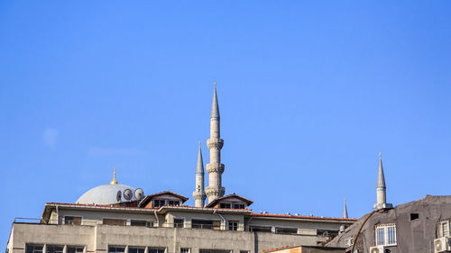 Low angle view of building against clear blue sky