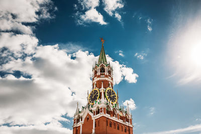 Low angle view of building against cloudy sky