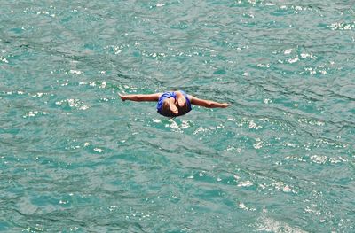 High angle view of man swimming in sea