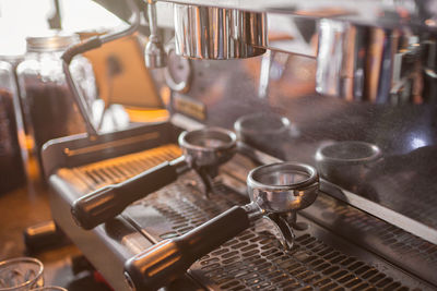 Worker works with a coffee machine