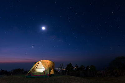 View of tent against star field at night