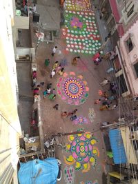 High angle view of people walking on multi colored city