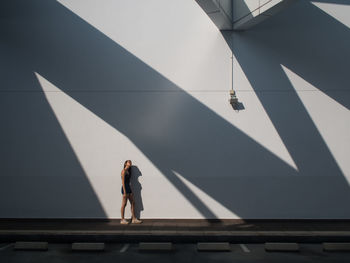 Low angle view of man standing on built structure