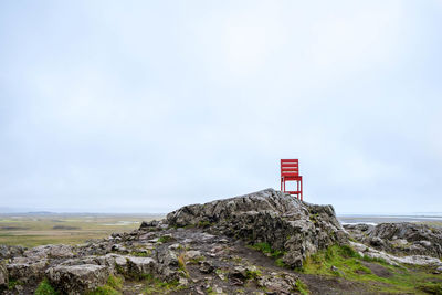 Scenic view of rock formation on land against sky