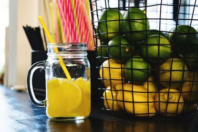 Close-up of juice in glass jar on table